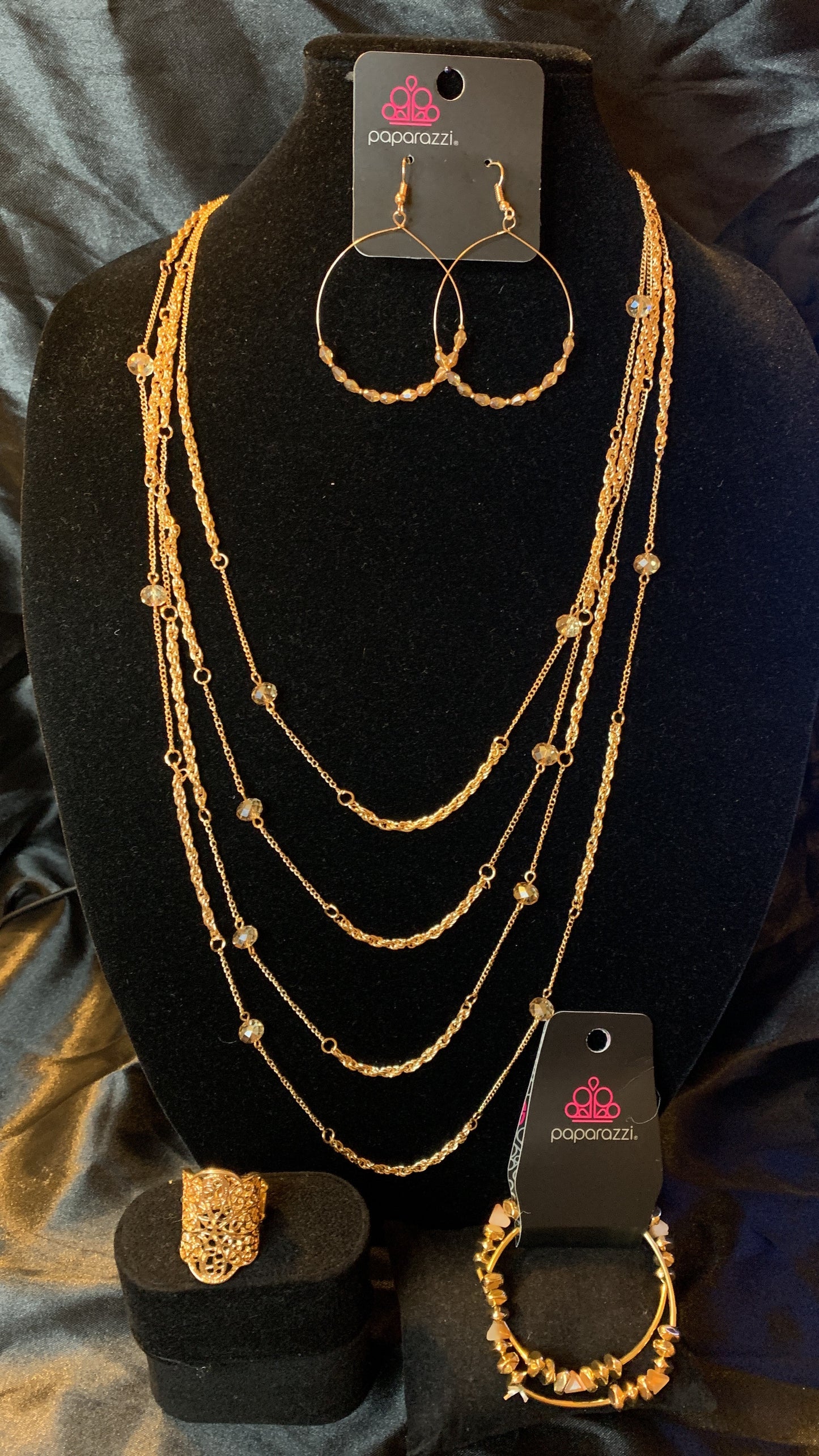 Paparazzi 4pc set color Gold with white rhinestones; includes: necklace, bracelet, earrings and ring