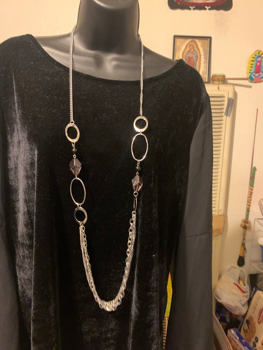 Black necklace with complementary earrings