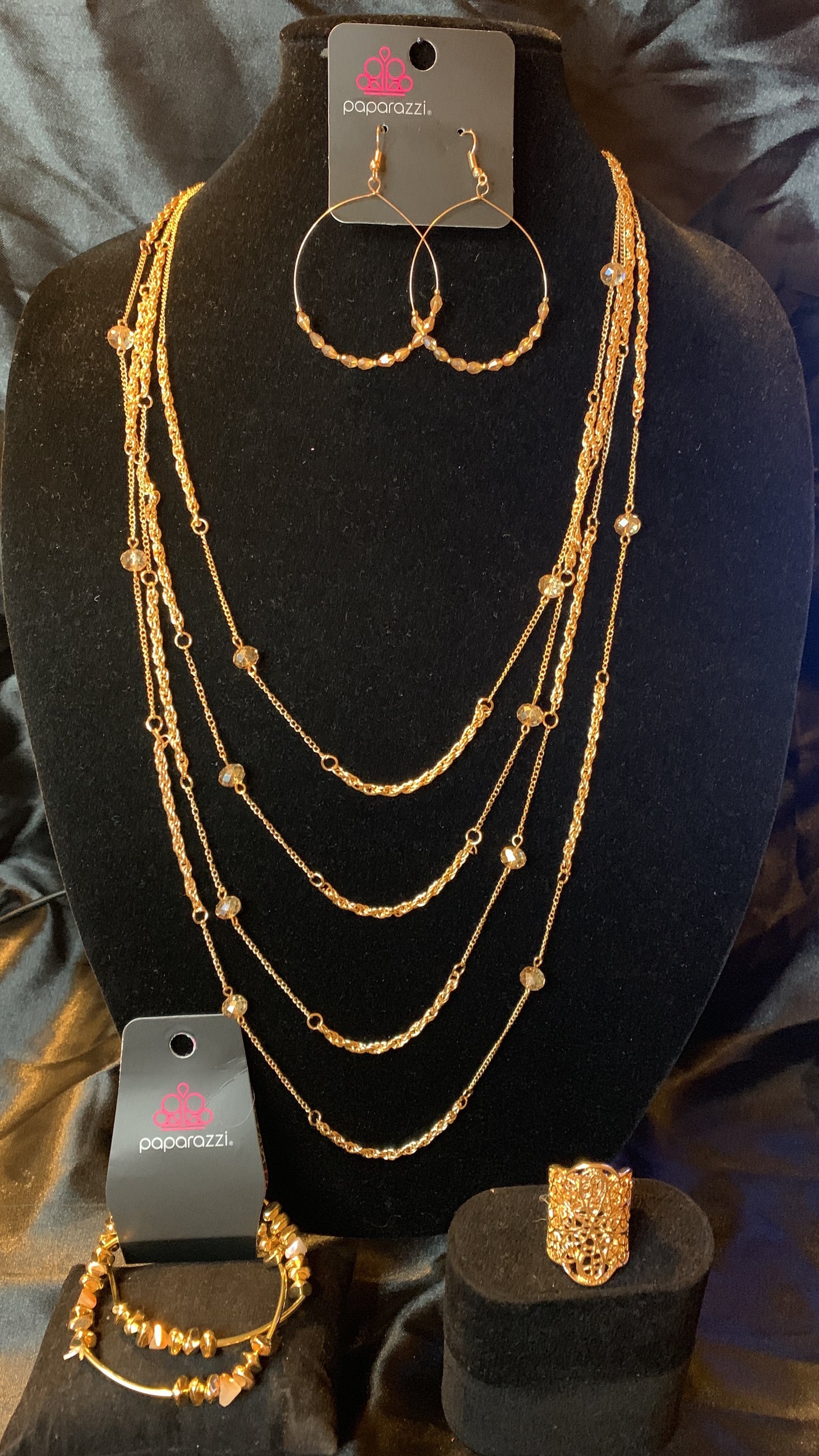 Paparazzi 4pc set color Gold with white rhinestones; includes: necklace, bracelet, earrings and ring